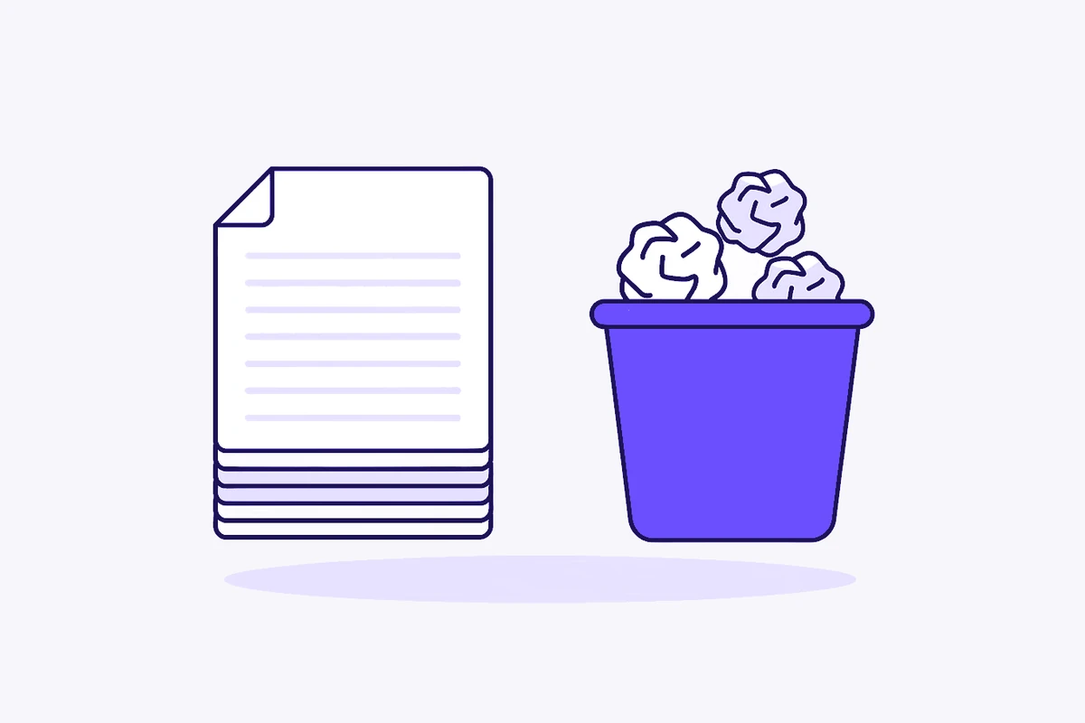 A neat stack of pages beside a violet bin full of crumpled paper.